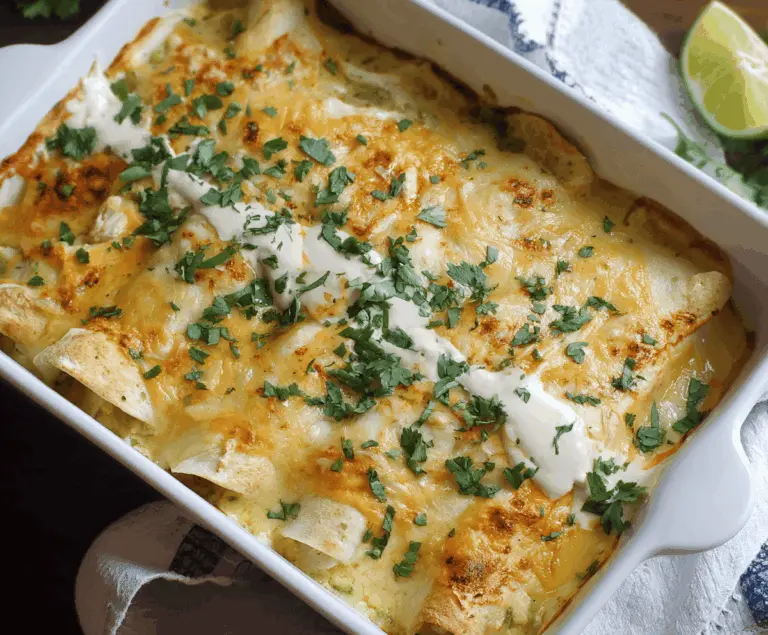 Delicious low carb white chicken enchiladas topped with cheese and cilantro on a plate, perfect for healthy dinner recipes