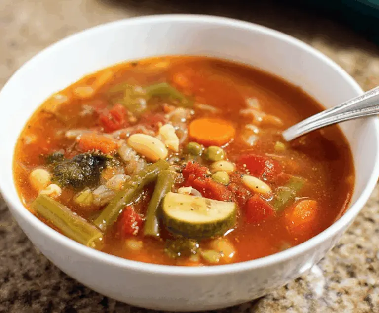Delicious homemade Olive Garden-style vegetable soup with fresh vegetables and herbs in a bowl