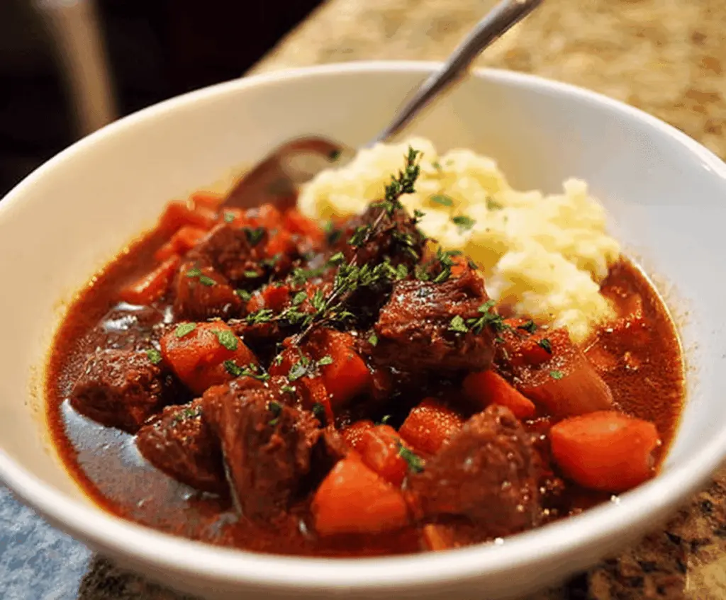 Delicious Pioneer Woman's Crockpot Beef Stew with tender beef, vegetables, and savory broth in a rustic bowl