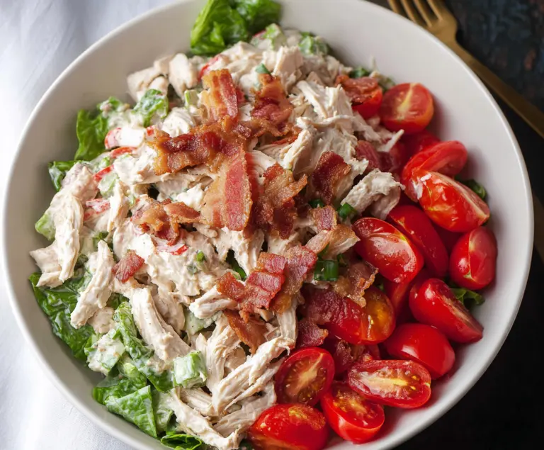 Delicious BLT Chicken Salad with crispy bacon, fresh lettuce, and juicy grilled chicken pieces.