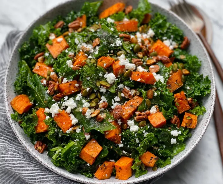Colorful kale and roasted sweet potato salad with fresh vegetables and herbs.