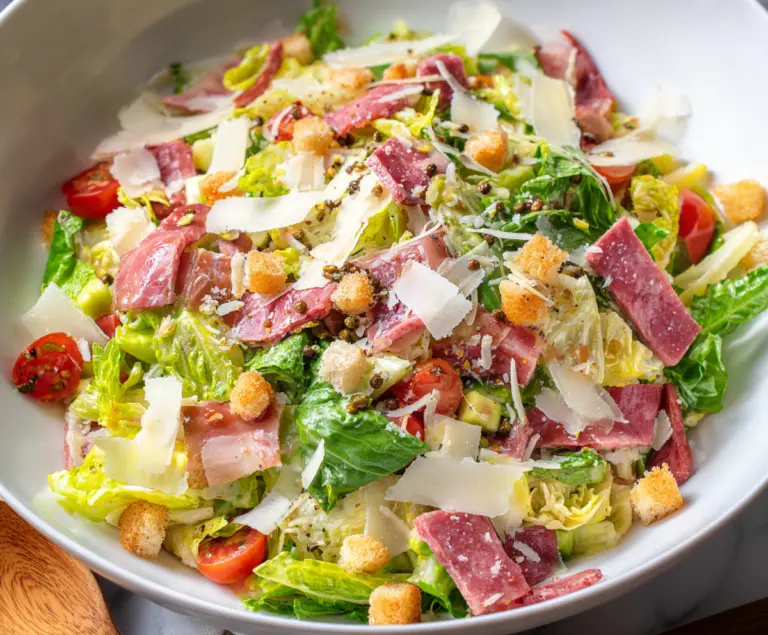 Colorful La Scala Chopped Salad with fresh vegetables and herbs, served in a white bowl.