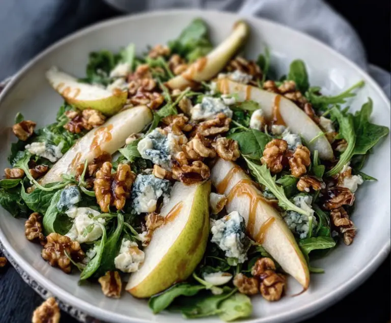 Fresh Pear and Gorgonzola Salad topped with Candied Walnuts in a stylish bowl for a delicious appetizer