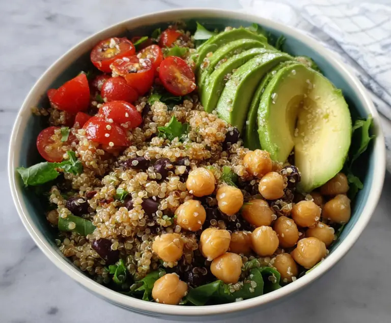 Healthy quinoa bowl featuring creamy avocado slices and protein-rich chickpeas, perfect for a nutritious meal.