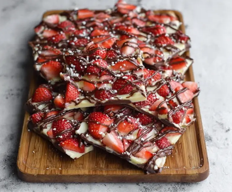 Delicious chocolate covered strawberry bark with fresh strawberries and smooth chocolate coating.