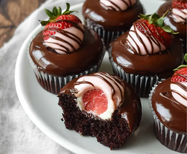 Delicious chocolate covered strawberry cupcakes with fresh strawberries and rich chocolate frosting