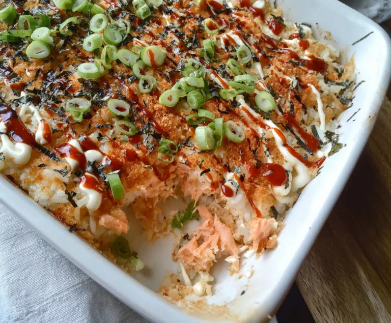 Delicious Spicy Salmon Sushi Bake with crispy topping and fresh ingredients