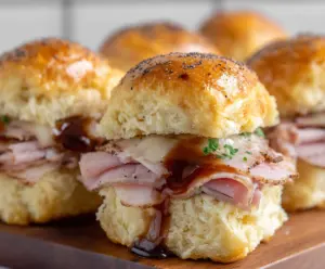 Delicious Brown Sugar Glazed Ham Biscuit Sliders for a savory appetizer or meal.